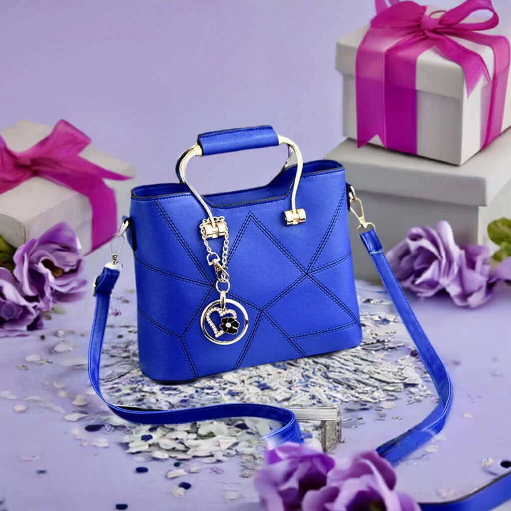 Blue quilted handbag with floral charm, gift boxes, and purple flowers
