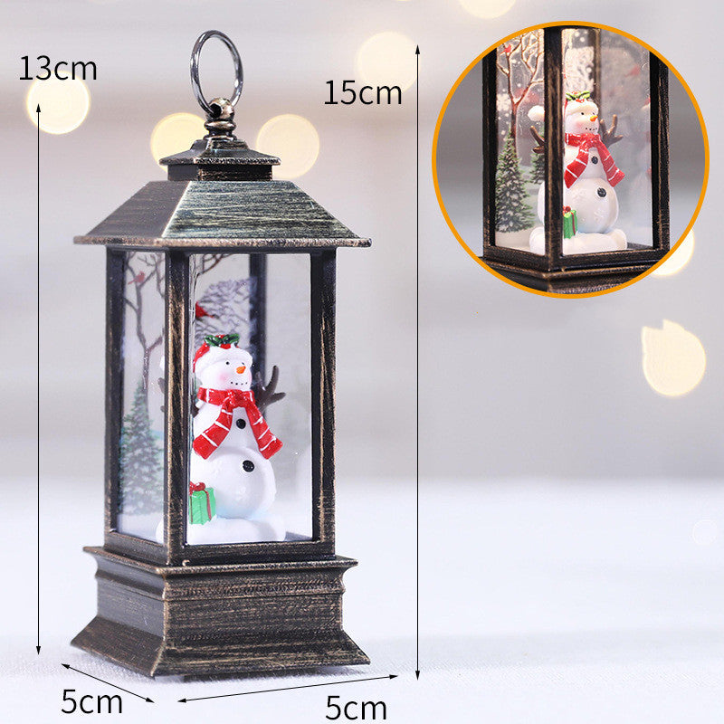Christmas LED Flame Oil Lamp featuring a decorative snowman inside a lantern, 13cm tall, perfect for festive decor.