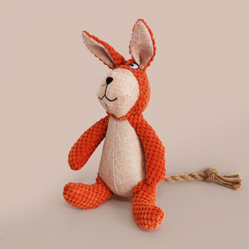 Toy Dinosaur Dog Doll Sounding Duck plush toy in orange color with floppy ears and a rope tail.