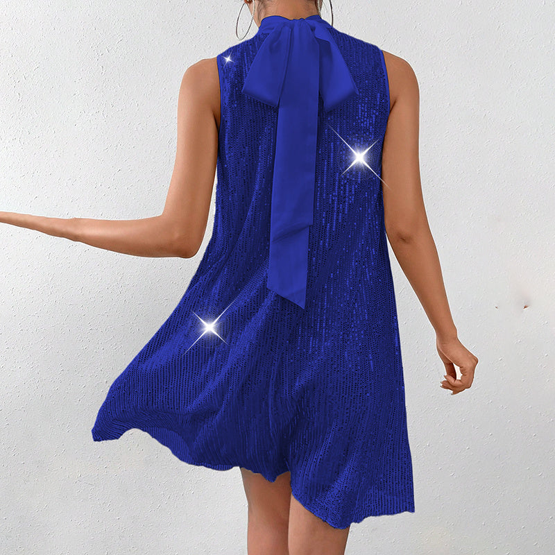 Women's sparkly sequin evening dress featuring a sleeveless design and bow detail at the back.