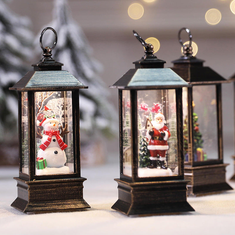 Christmas LED Flame Oil Lamp featuring holiday scenes with a snowman and Santa in decorative lanterns.
