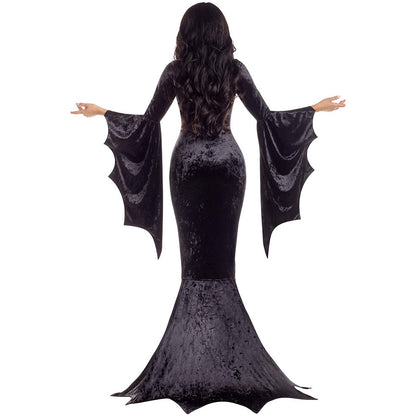Rear view of a woman in a long black Halloween Witch Ghost Costume with bat wing sleeves made of dense velvet.