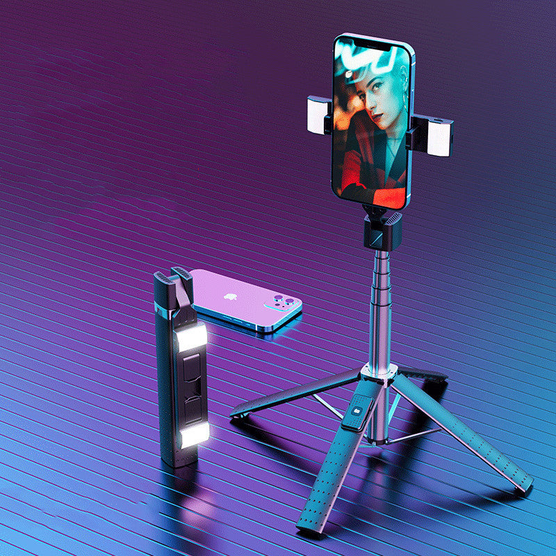 Bluetooth selfie stick with fill light positioned next to a smartphone on a tripod, showcasing the product features.